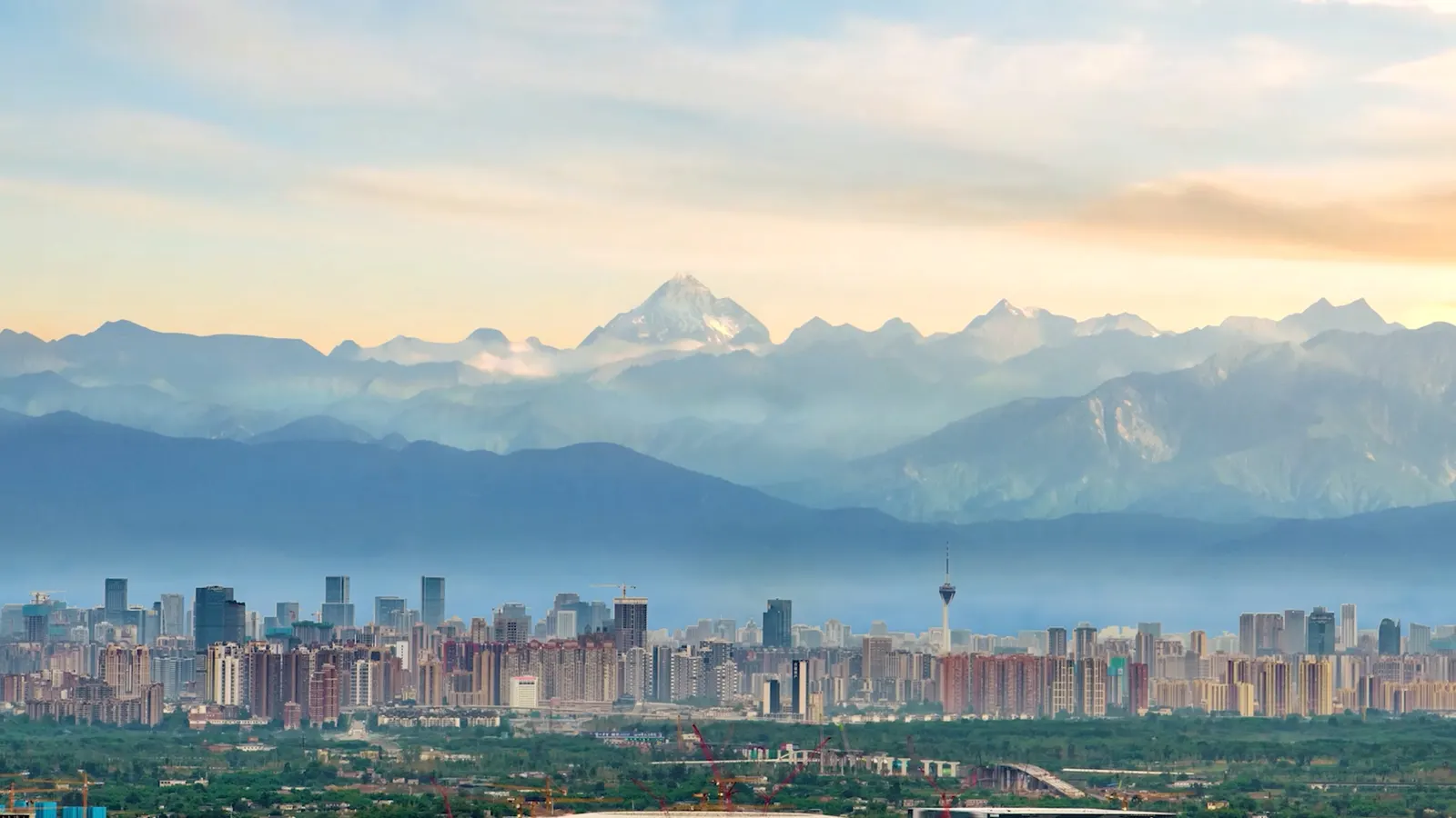 Chengdu skyline beneath the mountains of western Sichuan